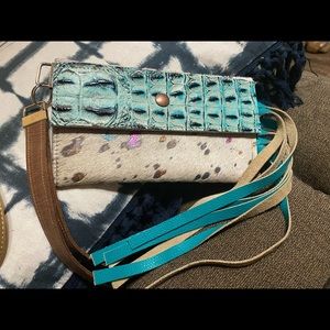 Cowhide wristlet with rainbow colors and tassel